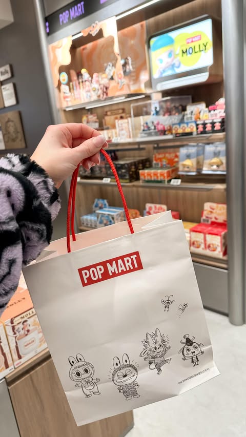 Instagram post by @hannaeverafter for Pop Mart. Caption reads: [...] be one of the first to visit our new....