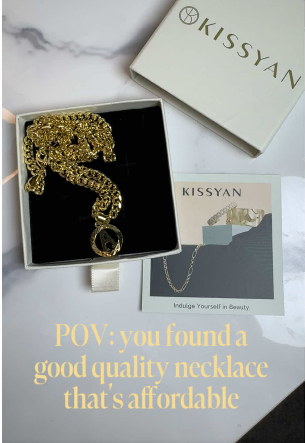 TikTok post by @andreayellstoo for KissYan Jewelry. Caption reads: [...] @KissYanOfficial @KissYan Jewelry....