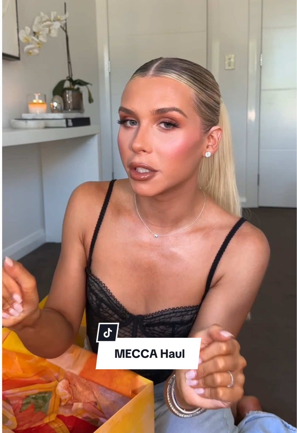 TikTok post by @mitch.greer for MECCA. Caption reads: [...] myself to a little Holiday gift shopping....