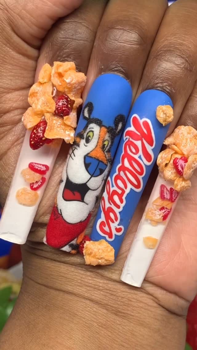 Instagram post by @polishedbykimmie for Kellogg's. Caption reads: Aren’t these nails 𝐆𝐑𝐑𝐑𝐑𝐄𝐀𝐀𝐓𝐓𝐓𝐓?!💙🥣....