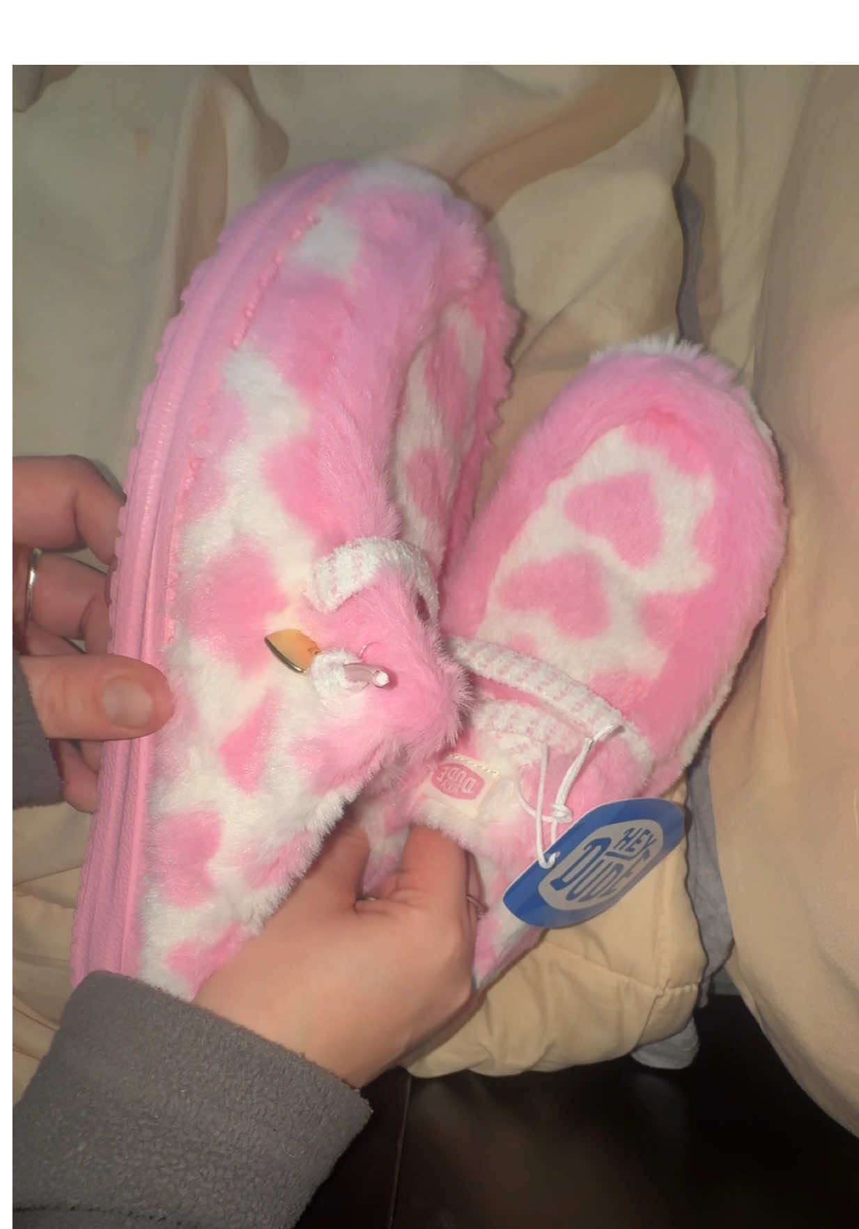 TikTok post by @emma.ry for HEYDUDE shoes. Caption reads: [...] are ADORABLE AND SO COMFY😍💕 #heydudeshoes....