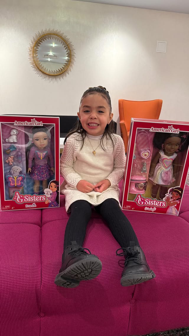 Instagram post by @ash316x for American Girl. Caption reads: Cataleya’s first time at @americangirlbrand nyc we....