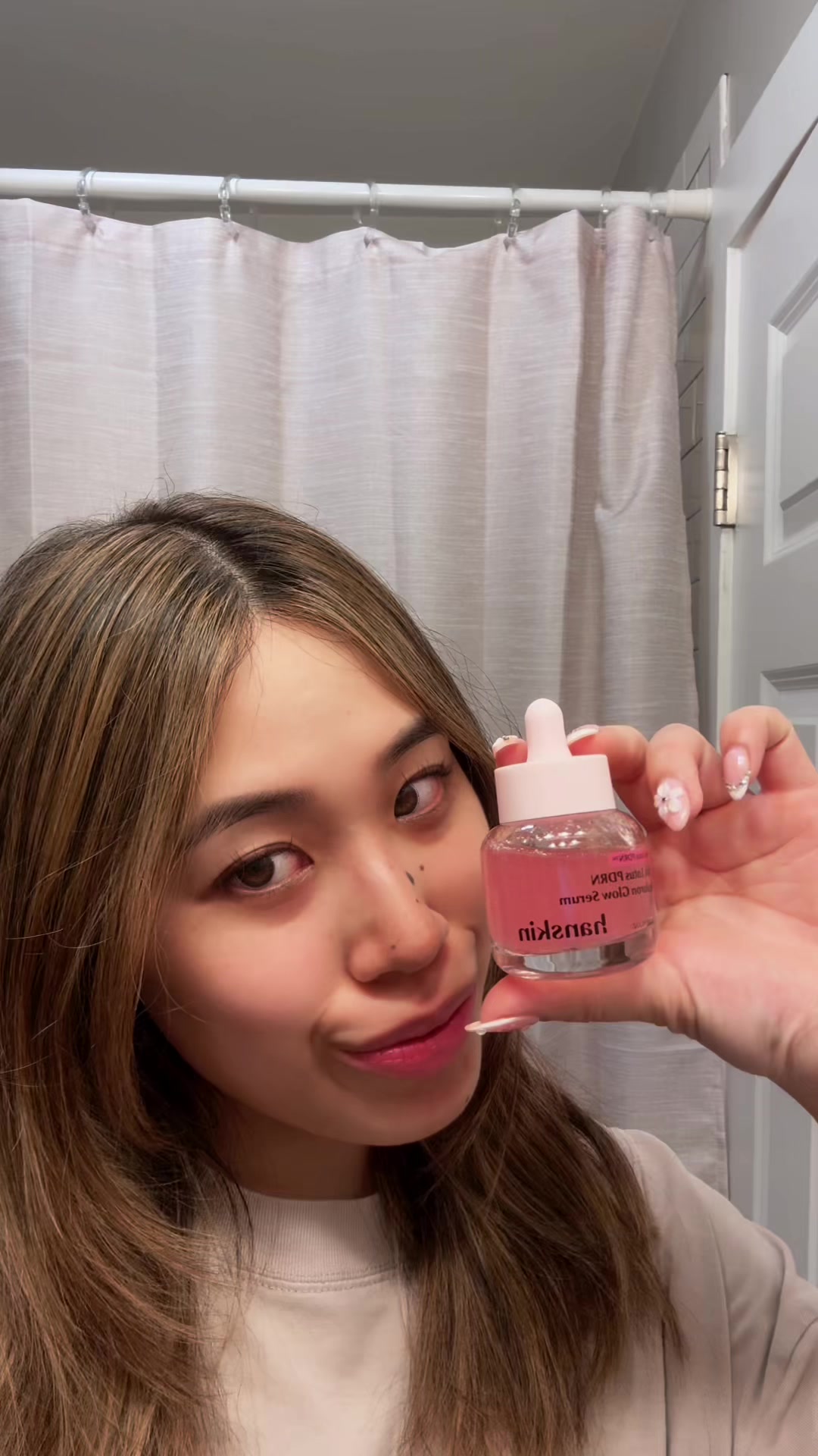 TikTok post by @sabrinaxchen_ for Hwahae Global Official. Caption reads: Hanskin Pink Lotus PDRN Hyaluron Glow Serum....