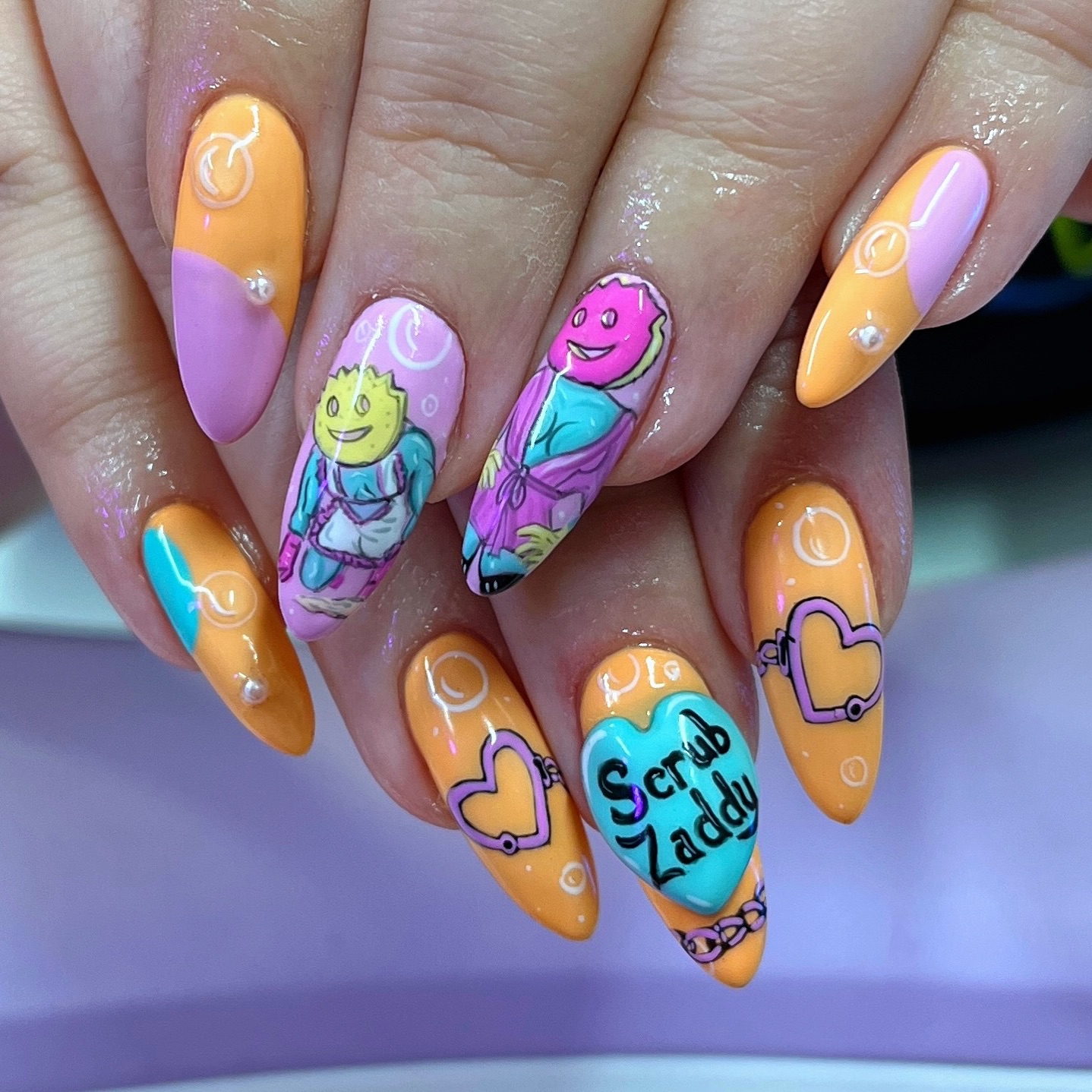 Instagram post by @naileditbychelsey for Scrub Daddy. Caption reads: 🧽 SCRUB ZADDY 🧽 recreation of @lucybluetattoo....