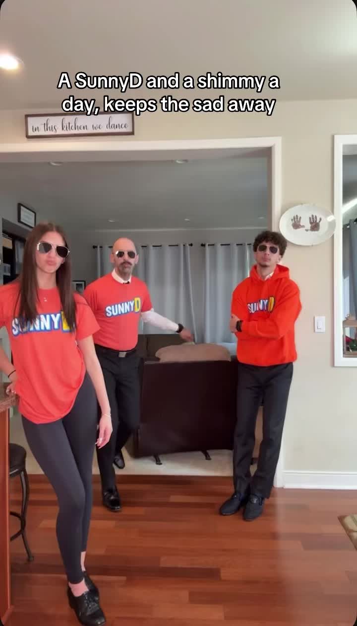 TikTok post by @jimmythegreek7 for SUNNYD. Caption reads: A SUNNYD and a shimmy a day keeps the sad away!....