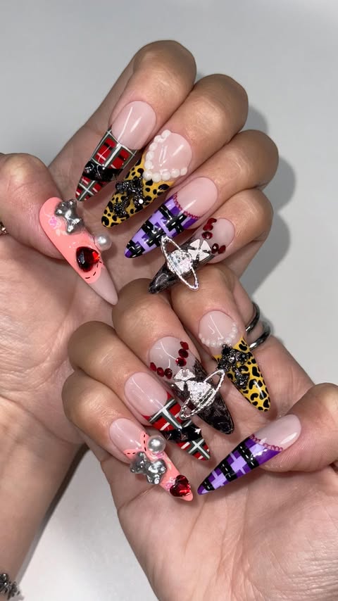 Instagram post by @nailsbyyenah for Vivienne Westwood. Caption reads: Nana x Vivienne Westwood nails 🖤❤️🇬🇧....