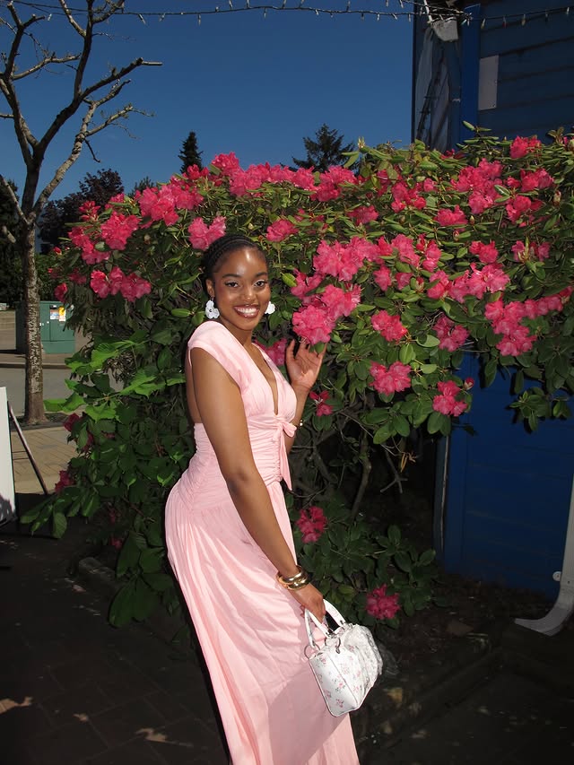 Instagram post by @theo_ug for PEPPERMAYO. Caption reads: Blooming 🌸🤍 Dress: @peppermayo #fyp #peppermayo....
