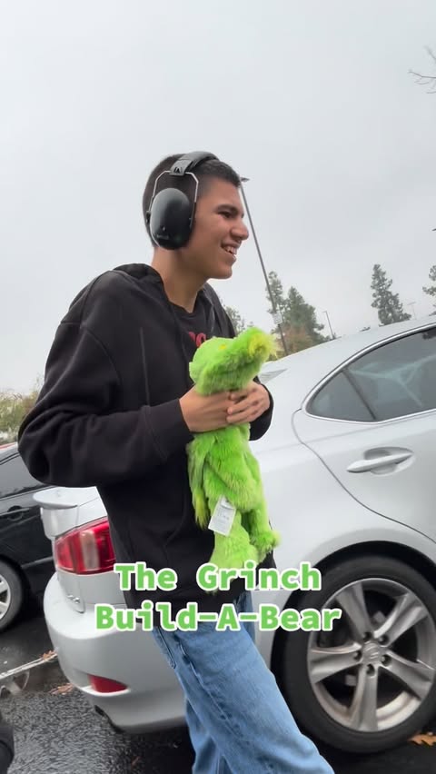 Instagram post by @magicwiththomas for Build-A-Bear. Caption reads: Thomas stuffing the Grinch @buildabear 

#autism....