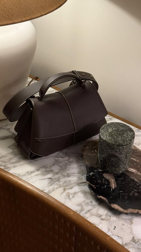 Instagram post by @karo.couture for WAT THE BRAND. Caption reads: My outfit formula is usually simple: a clean base....