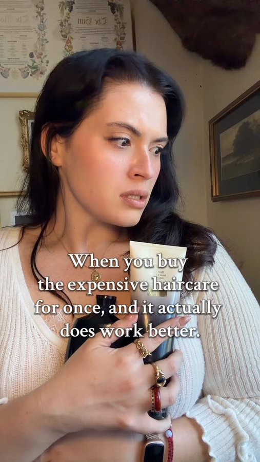 Instagram post by @thewolfinlace for Oribe. Caption reads: So now I just gotta spend $50 on shampoo for the....