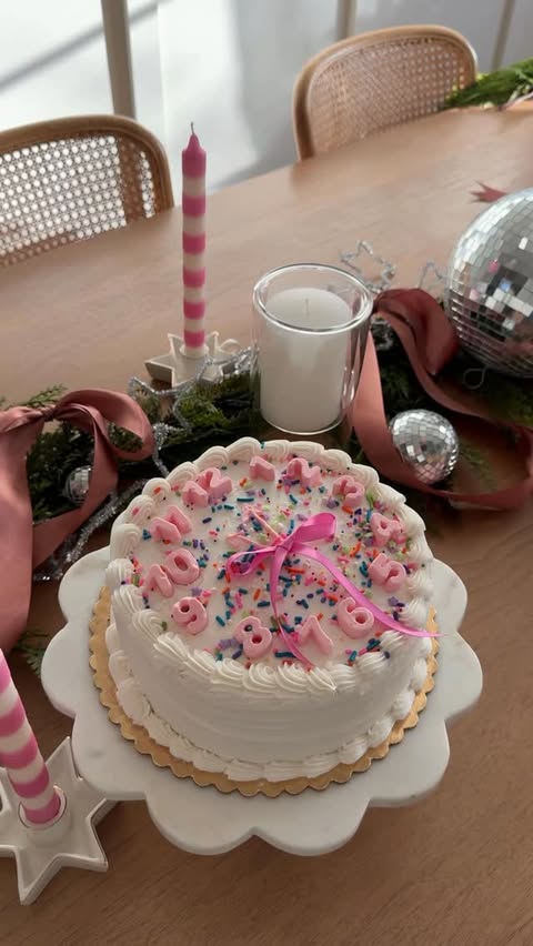 Instagram post by @debtrette for Nuuly. Caption reads: a clock cake to kick off 2026!! 🕰️ order a plain....