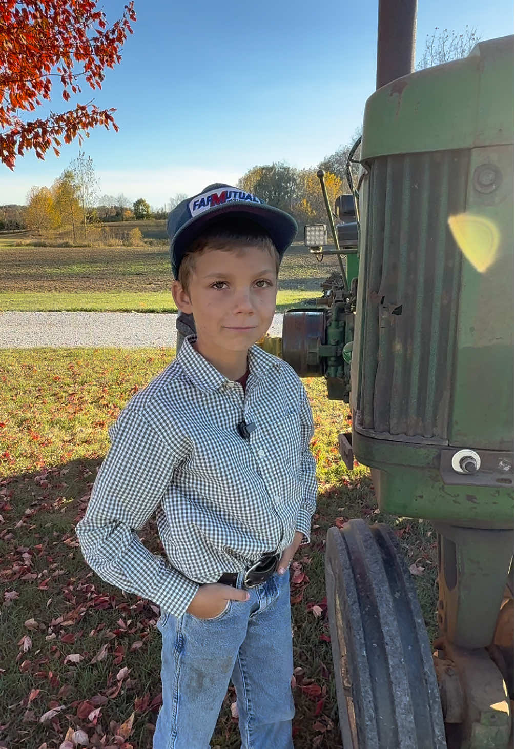 TikTok post by @justajacksonthing for John Deere. Caption reads: Jackson does a walk around with his @John Deere 60....