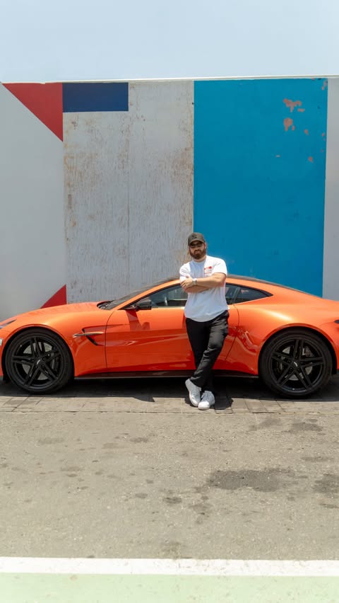 Instagram post by @myparents_are_divorced for Aston Martin. Caption reads: [...] of Dubai and behind the wheel of Aston....