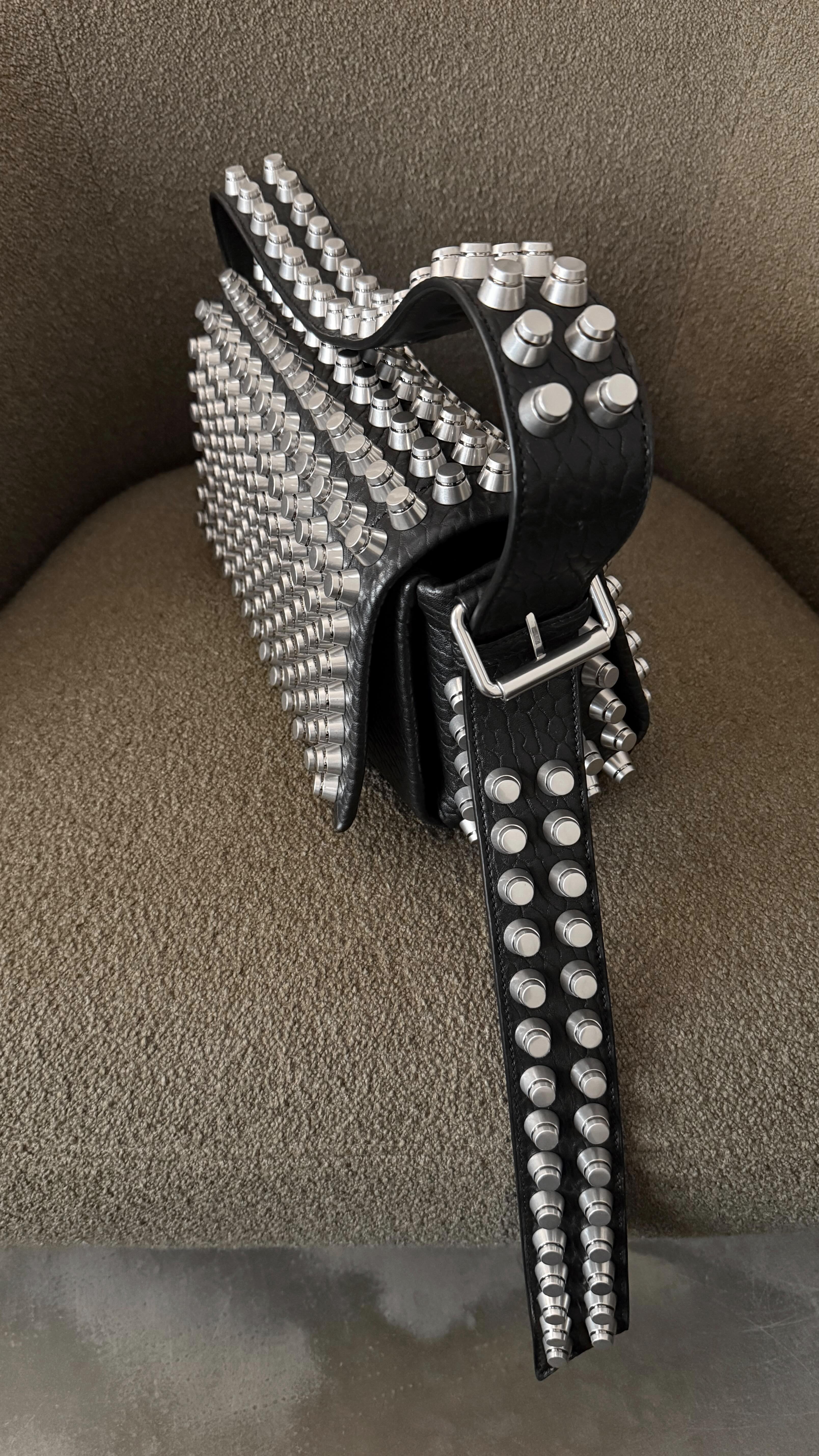 Instagram post by @kelbinlei for alexanderwang. Caption reads: Unboxing the heaviest bag that I have😅🩶.