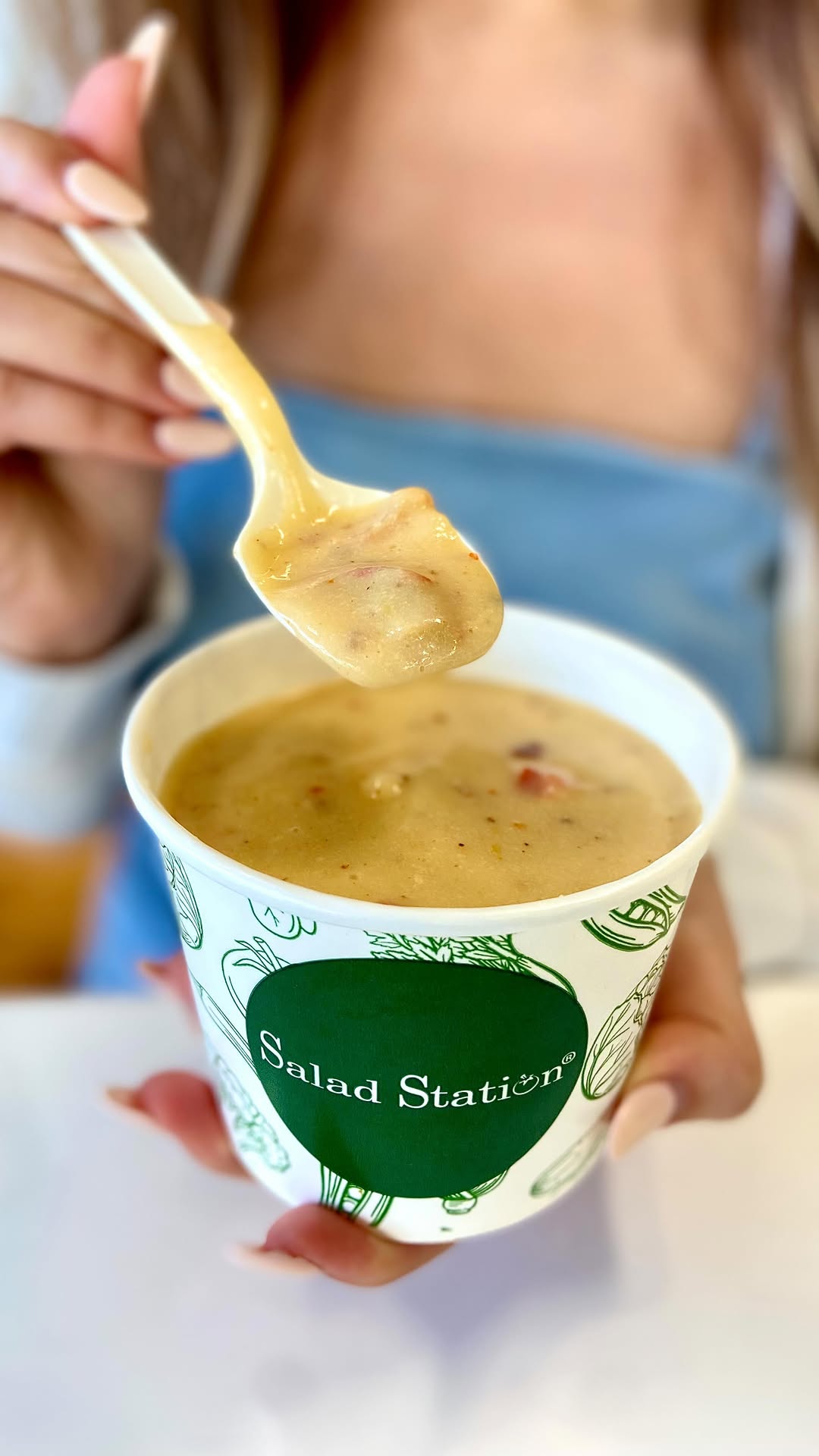 Instagram post by @lynniethefoodie for Salad Station. Caption reads: [nola] Trying to fish for that perfect piece of....