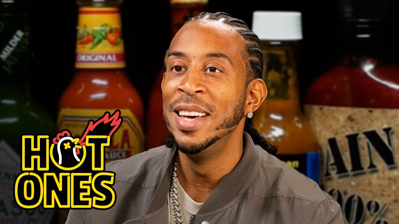 YouTube post by @FirstWeFeast for First We Feast. Caption reads: Ludacris Gets Fired Up While Eating Spicy Wings |....
