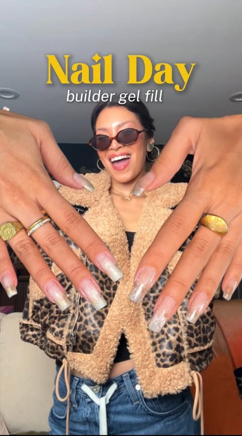 Instagram post by @juliageezy for Rent the Runway. Caption reads: It's Nail Day and @juliageezy is leaning into....