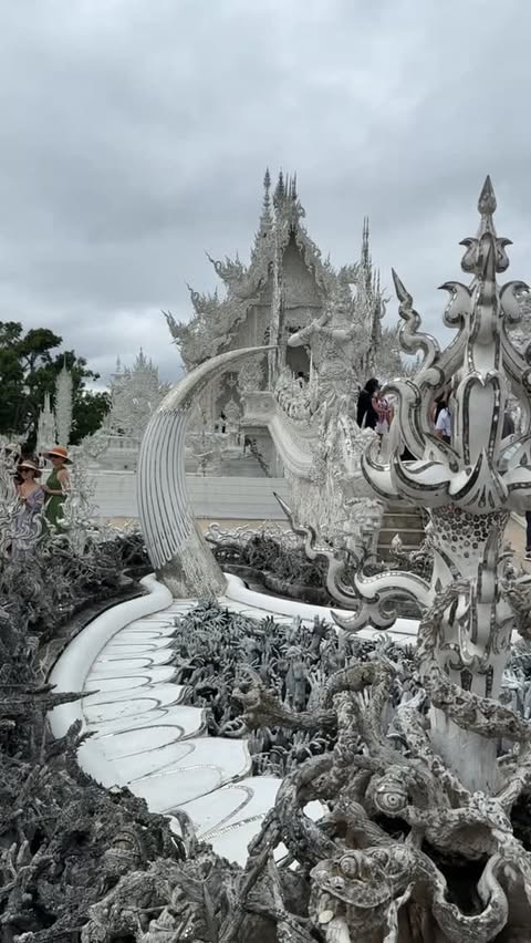 Instagram post by @lone_meanderer for GetYourGuide. Caption reads: #getyourguide | Lalitta Café, Chiang Rai White &....