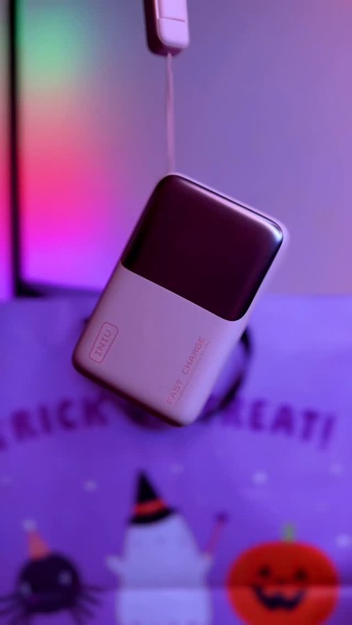 Instagram post by @claricecalazans for INIU Shop. Caption reads: 🎃 Trick or Charge? 🍬⚡

This Halloween, I’m....