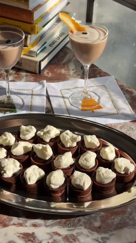 Instagram post by @saturdaytable for World Market. Caption reads: Snacks & Sips Episode 10: mini chocolate & orange....