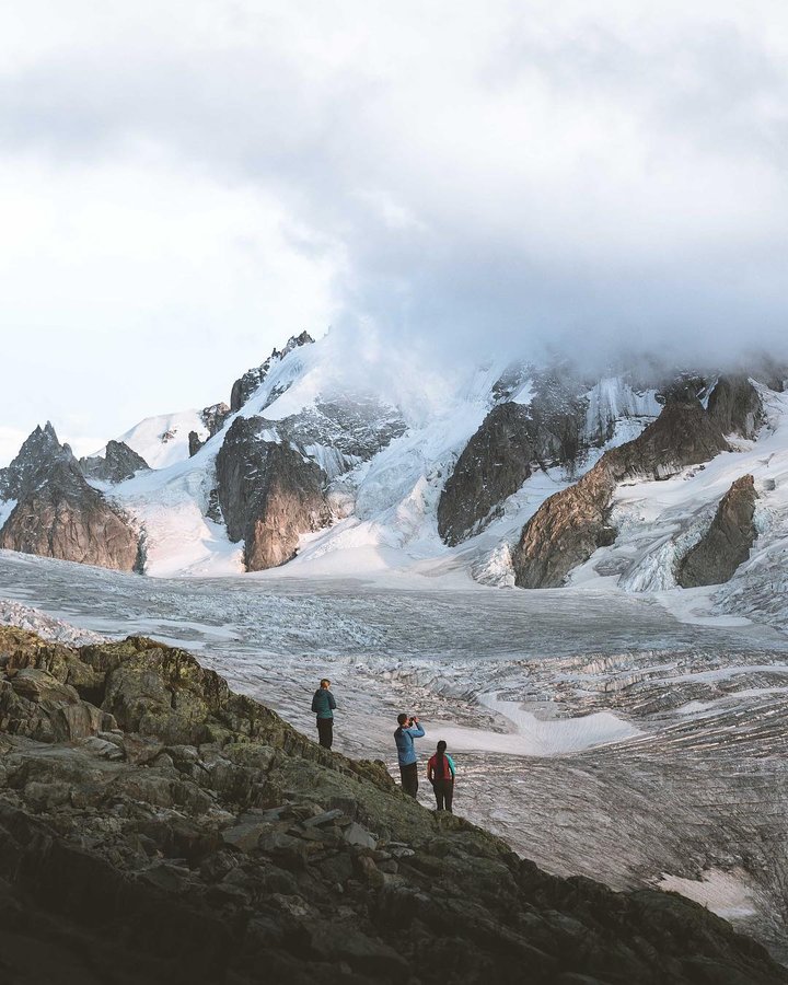 Instagram post by @exploremarco for Discover Earth. Caption reads: Since the beginning, mountains have always been my....