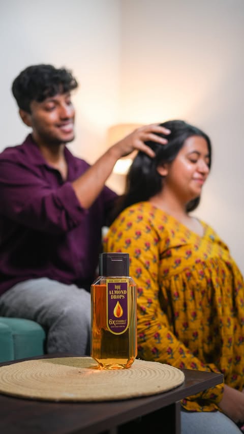 Instagram post by @_mitsandakash_ for Bajaj Almond Drops. Caption reads: [...] with this oiling routine with Bajaj Almond....