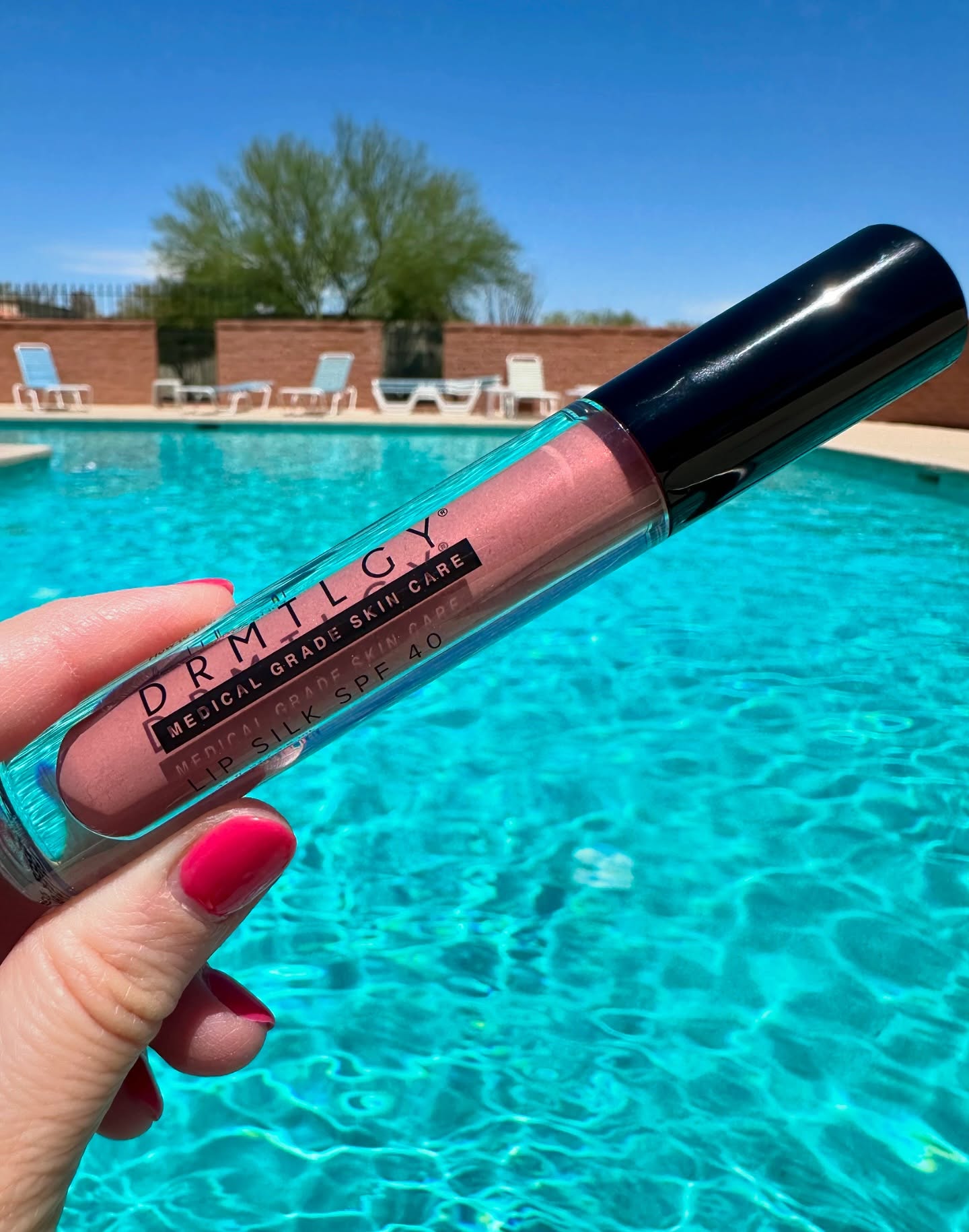 Instagram post by @beautybyalli23 for DRMTLGY. Caption reads: This Lip Silk spf 40 from @drmtlgy has been saving....