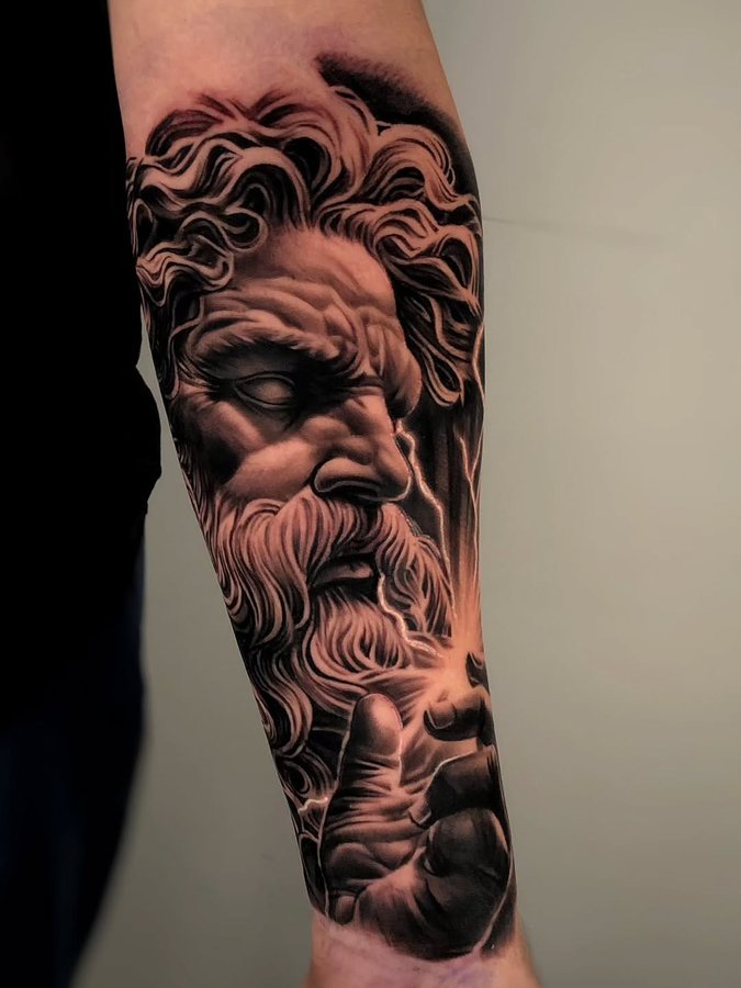 Instagram post by @mager_tattoos for Affirm. Caption reads: ZEUS | Text (877)503-2977 for booking info.

Get....