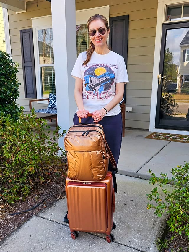 Instagram post by @agirlinshades2 for CALPAK. Caption reads: [...] weekend’s getaway ⛰️🤎 This matching @calpak....