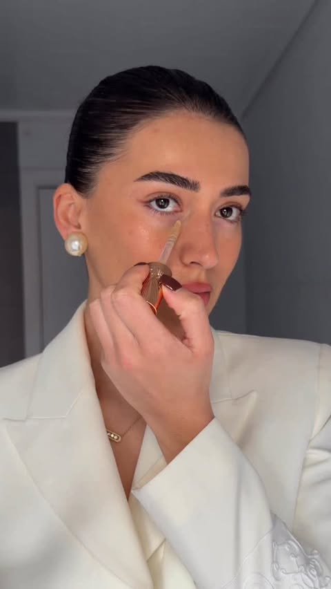 Instagram post by @sherienboni for Charlotte Tilbury. Caption reads: [...] effect with one concealer -....