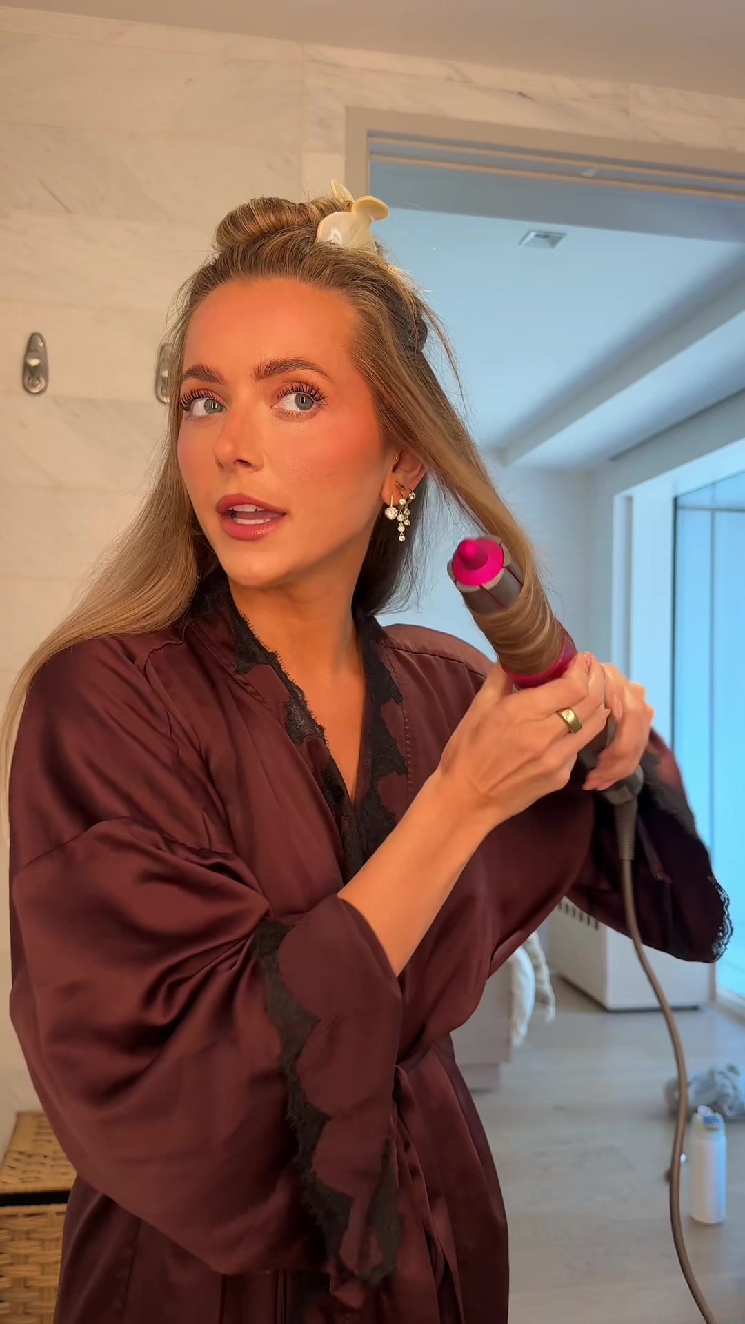 TikTok post by @abbybaffoe for Amika. Caption reads: [...] time 💖 Both products used are from @amika....