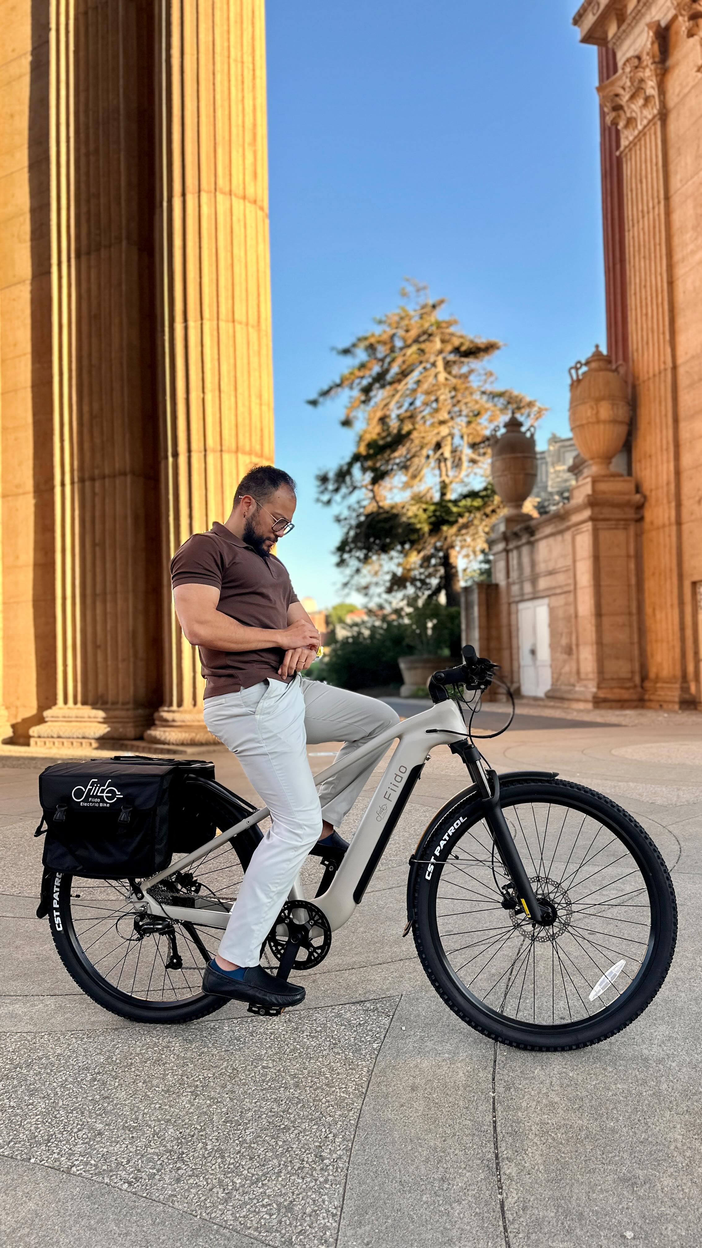 Instagram post by @tarikdeliktas for Fiido. Caption reads: [...] meets San Francisco vibes 💫
The @fiidoebike....