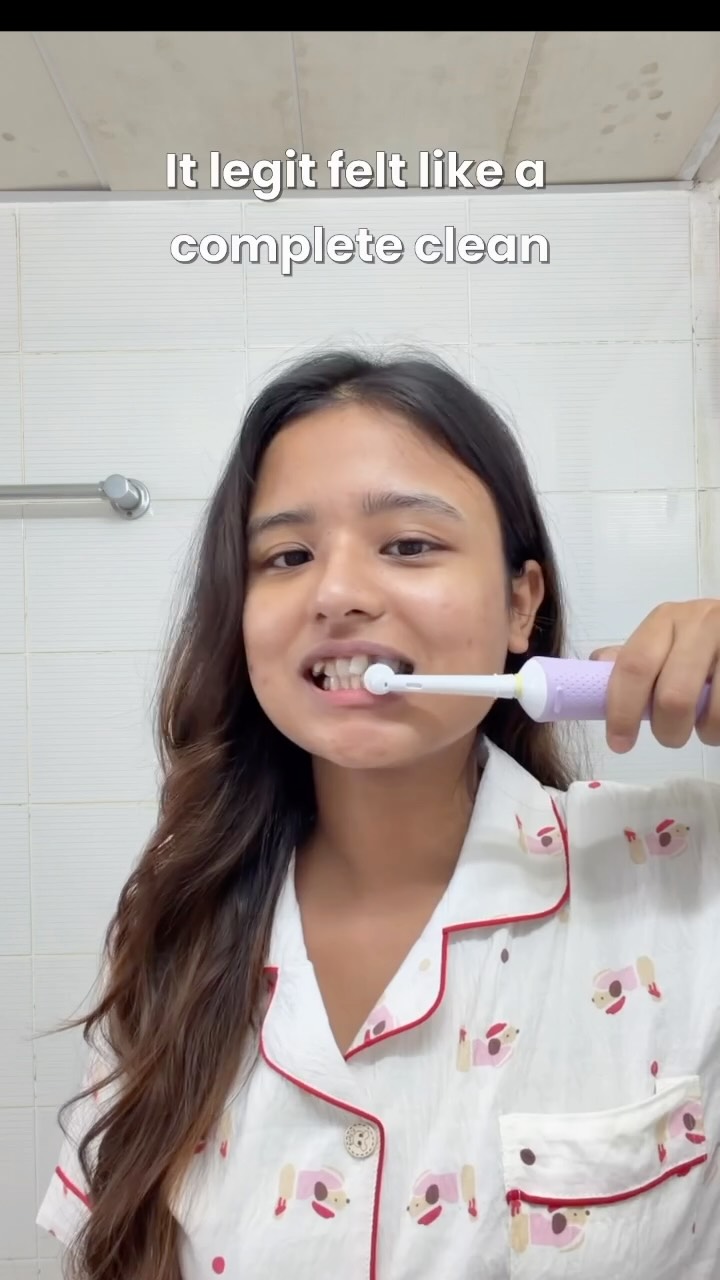 Instagram post by @thatchicgirll for Oral-B. Caption reads: Electric brush > manual brush. The upgrade my....
