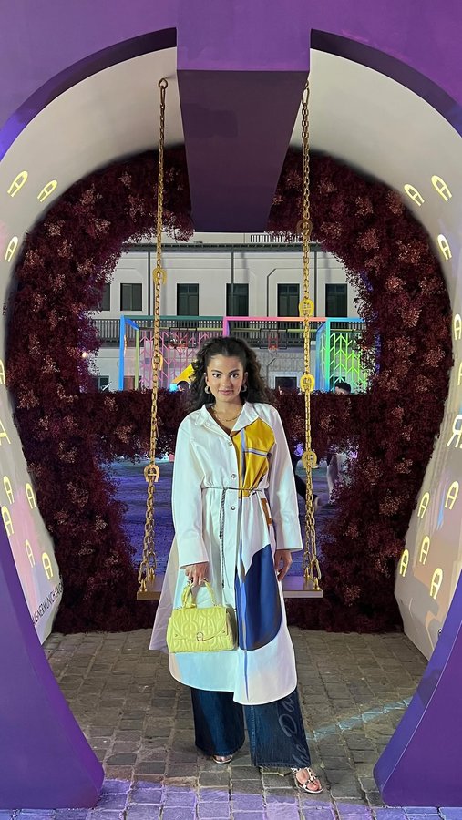 Instagram post by @ajwaaljoudi for Etienne Aigner AG. Caption reads: Love is in the air!💛🌊

@aignermunich....