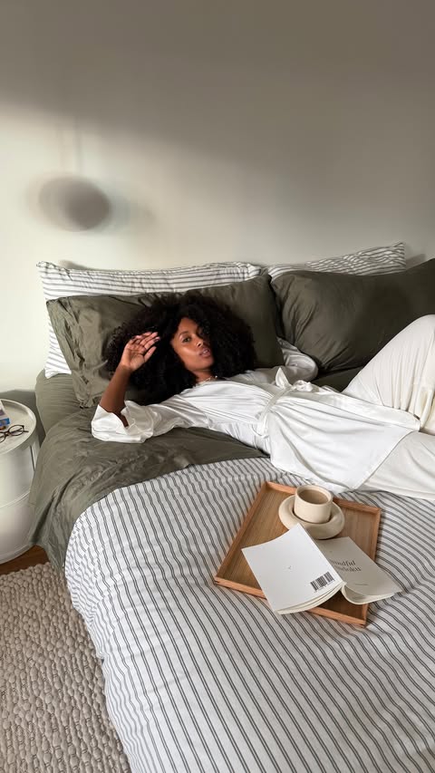 Instagram post by @claire_most for Brooklinen. Caption reads: Best in bed with Brooklinen ☁️ If you’re reading....