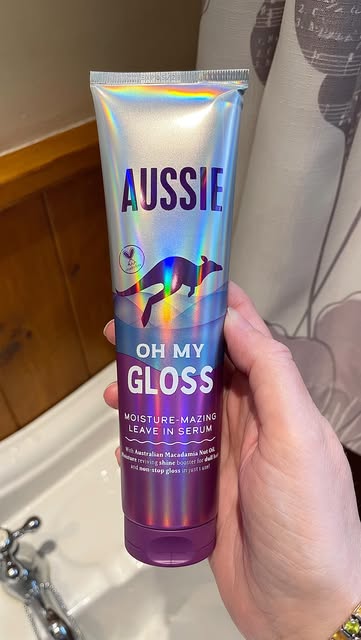 Instagram post by @shesintothewild for SuperSavvyMe. Caption reads: Discover your new summer hair obsession: Aussie Oh....
