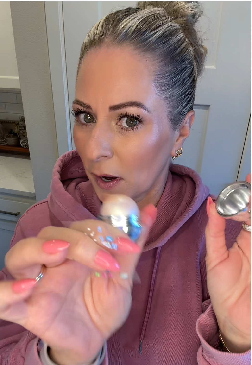 TikTok post by @thesaltyblondestylist for Godmode Beauty. Caption reads: Genesis glow highlighter from @GODMODE BEAUTY such....