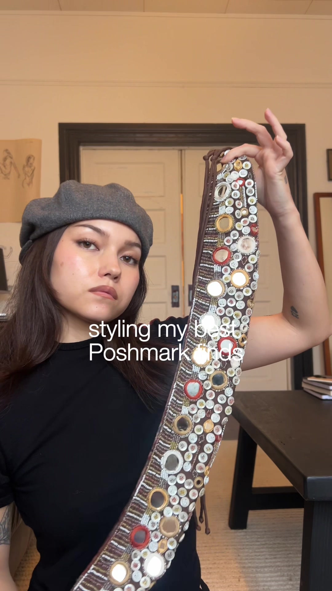 TikTok post by @emmyqandrews for Poshmark. Caption reads: styling my all-time @Poshmark finds....