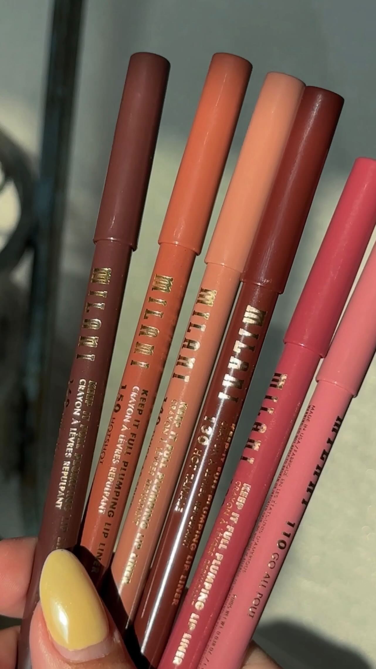 Instagram post by @janjan.maria for Milani Cosmetics. Caption reads: swatching every shade of the new @milanicosmetics....
