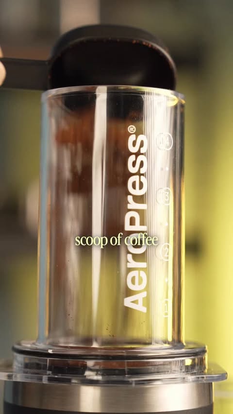 Instagram post by @amanwithcoffee for AeroPress. Caption reads: From airports to mountain tops — the AeroPress Go....