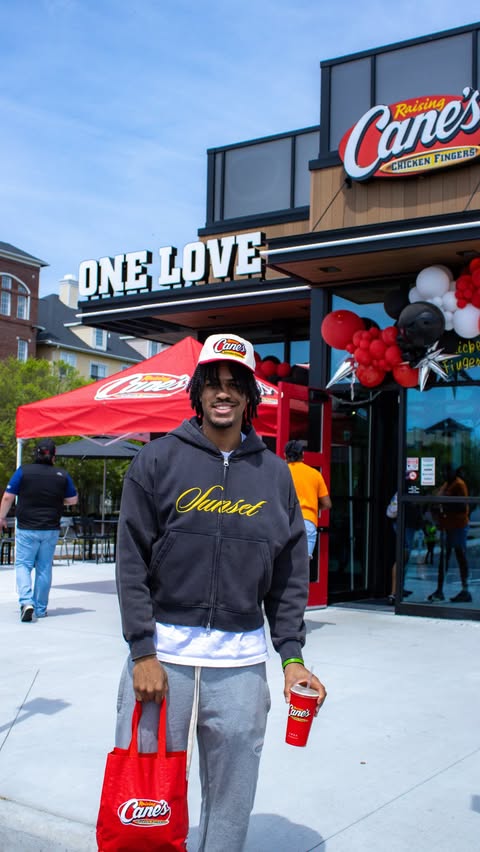 Instagram post by @z.wigg for Raising Cane's. Caption reads: [...] opening energy and then some 😎🍟....