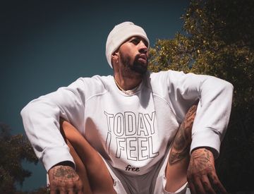 Instagram post by @fencer for DKNY. Caption reads: Today I feel free. Free from negativity, free from....