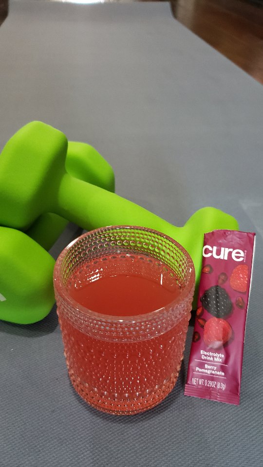 Instagram post by @eatanddrinkhouston for Cure Hydration. Caption reads: [...] on the go, so I'm thankful for 💦 CURE....