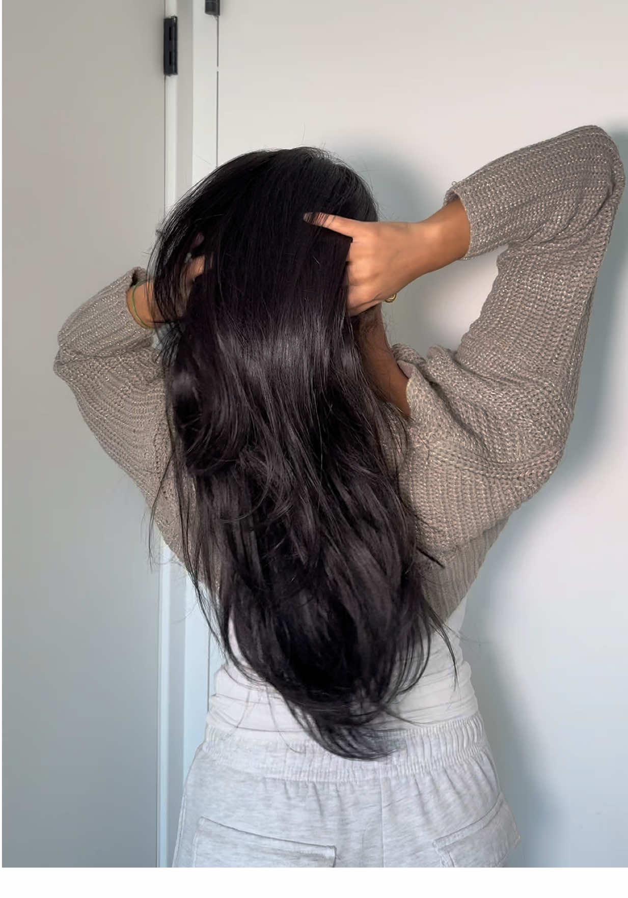 TikTok post by @zizzysizzle for Amika. Caption reads: Soft hair starts in the shower ✨ @amika @Ulta....