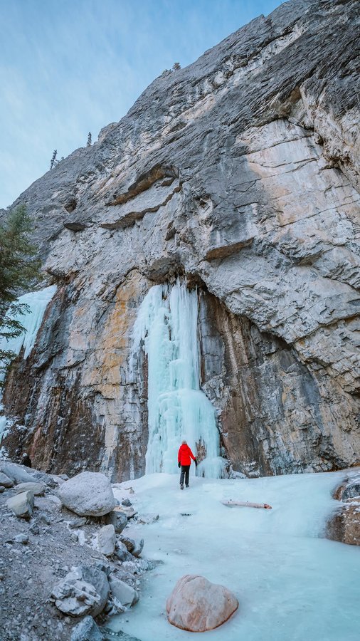 Instagram post by @wellnesstravelled for Travel Alberta. Caption reads: VISITING BANFF OR CANMORE? Add this hidden gem....