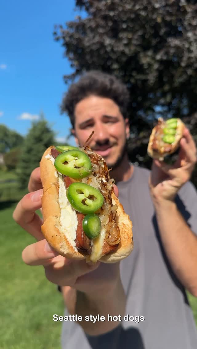 Instagram post by @chefcuso for Tillamook. Caption reads: Seattle-style hot dogs with bold @Tillamook Cheese....