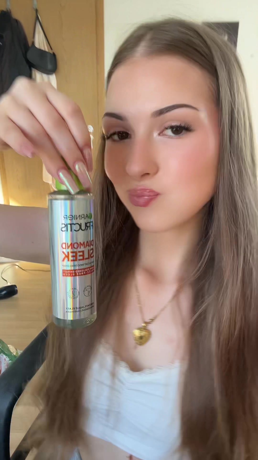 TikTok post by @heartofgoddess for Garnier CZ/SK. Caption reads: garnier diamond sleek spray 🎀#reklama @All 2 test....