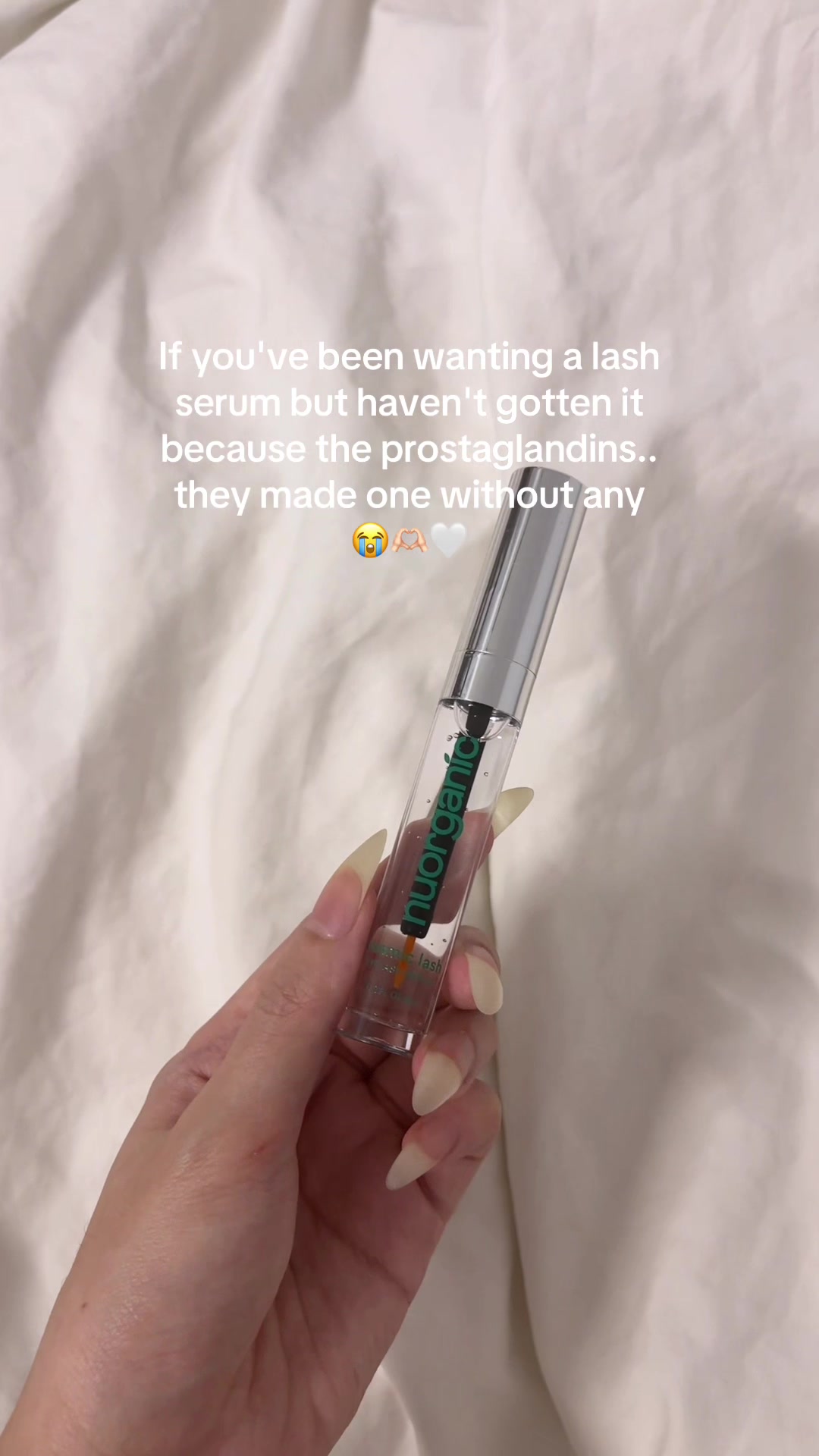 TikTok post by @carewithmi for Nuorganic. Caption reads: best eyelash serum for longer,thicker....