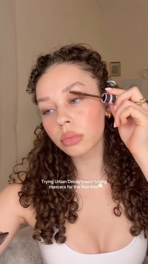 Instagram post by @joyburnettt for Urban Decay. Caption reads: So natural and not clumpy at all....