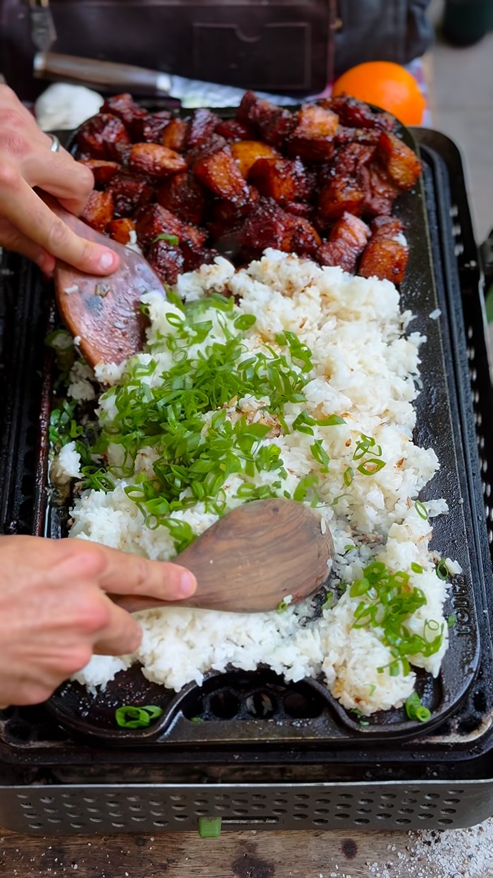 Instagram post by @livefirerepublic for Lodge Cast Iron. Caption reads: [...] Belly Fried Rice, all prepared over....